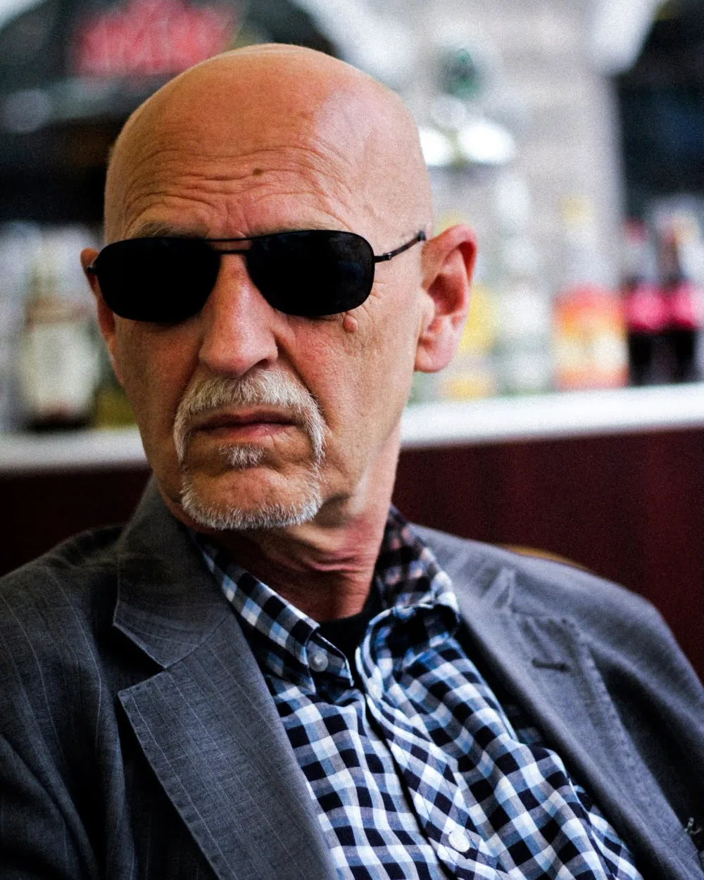 A man in sunglasses photographed at a Copenhagen cafe.